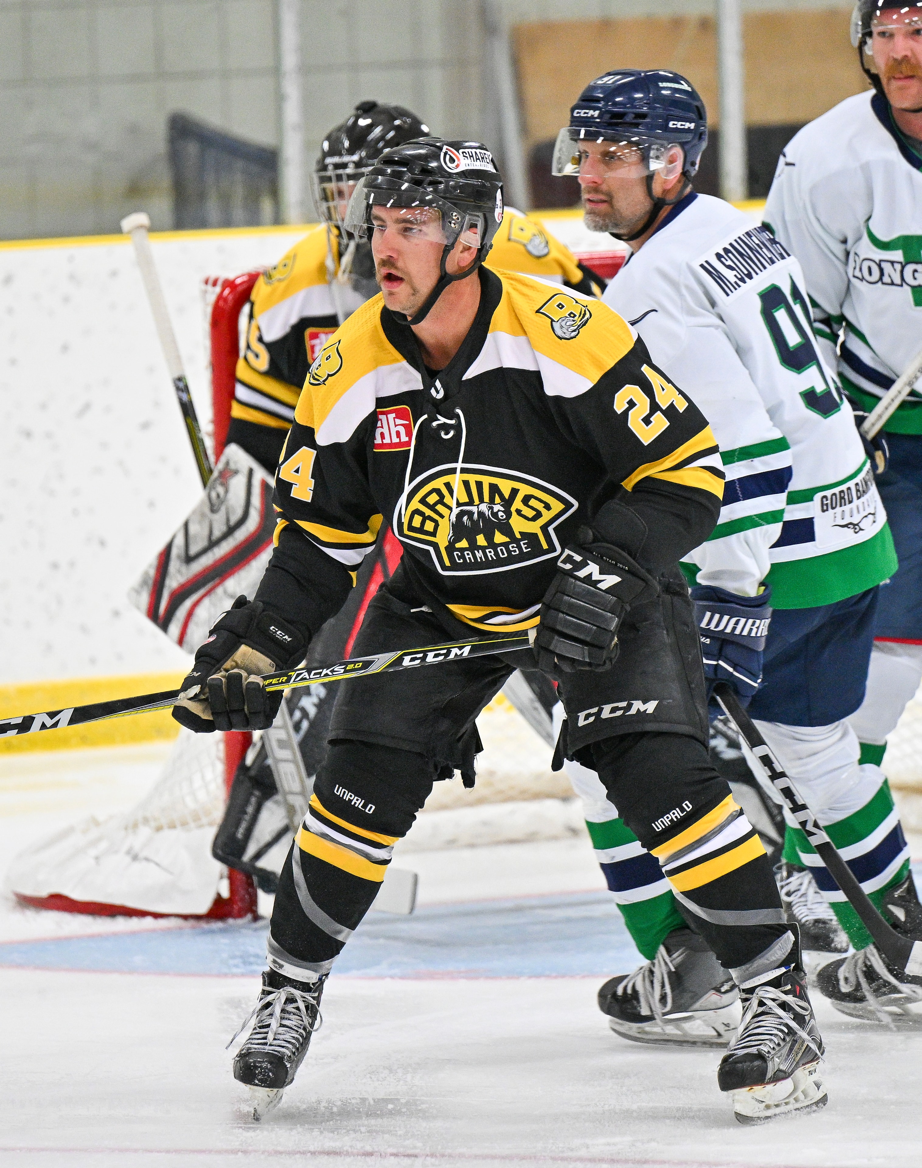 Bruins player #24 in game action